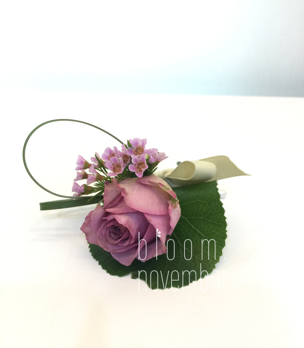 purple corsage flower
